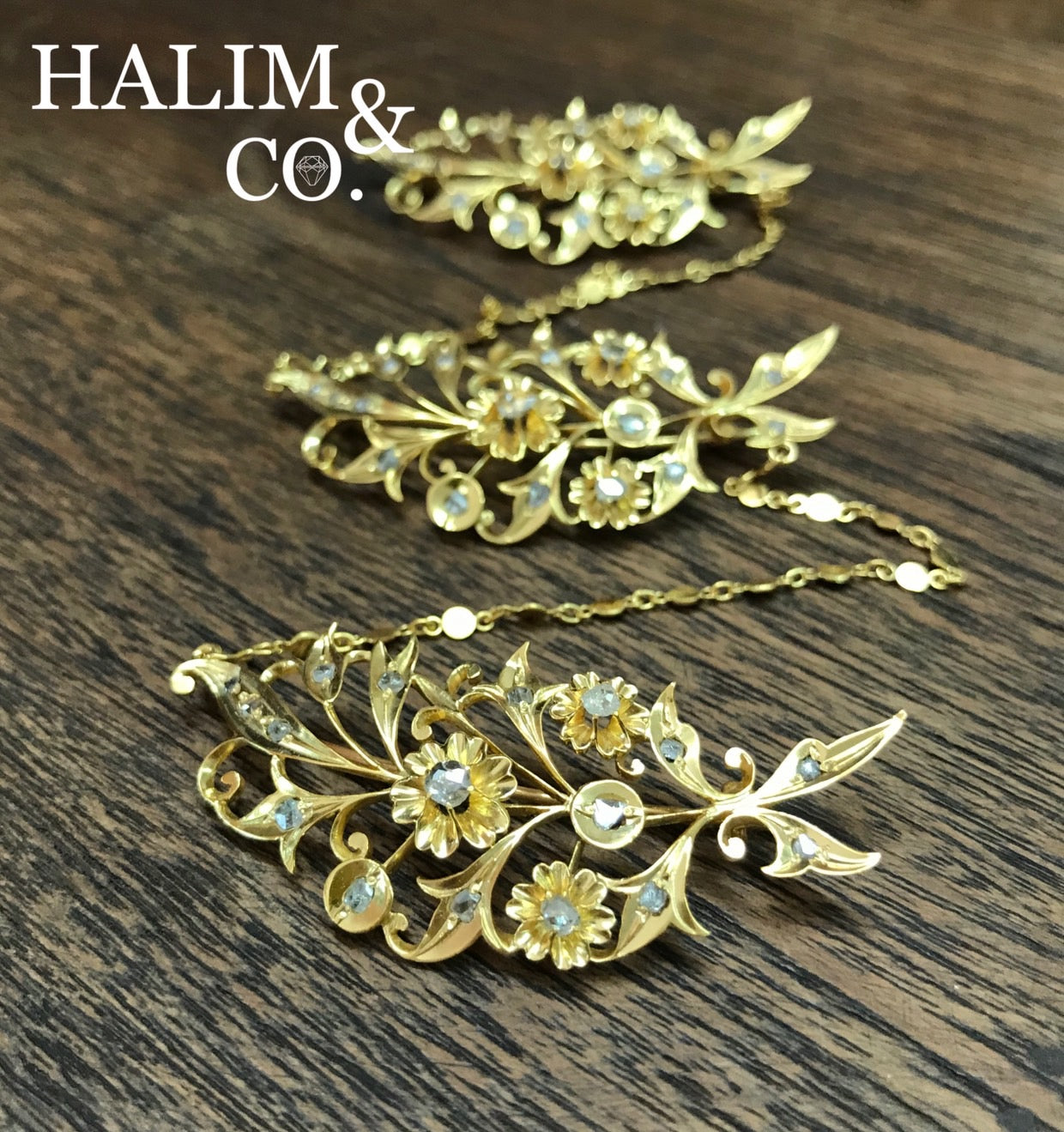 A gorgeous set of three antique gold brooches set with polki diamonds with patterned chains.