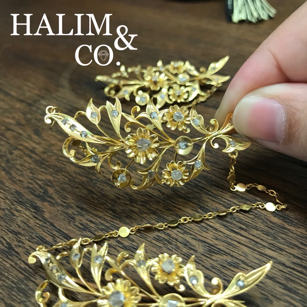 A gorgeous set of three antique gold brooches set with polki diamonds with patterned chains.