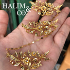 A gorgeous set of three antique gold brooches set with polki diamonds with patterned chains.