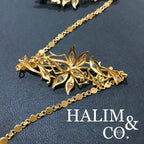 A gorgeous set of three antique gold brooches set with polki diamonds with patterned chains.