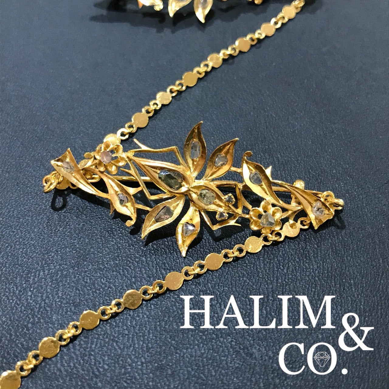 A gorgeous set of three antique gold brooches set with polki diamonds with patterned chains.