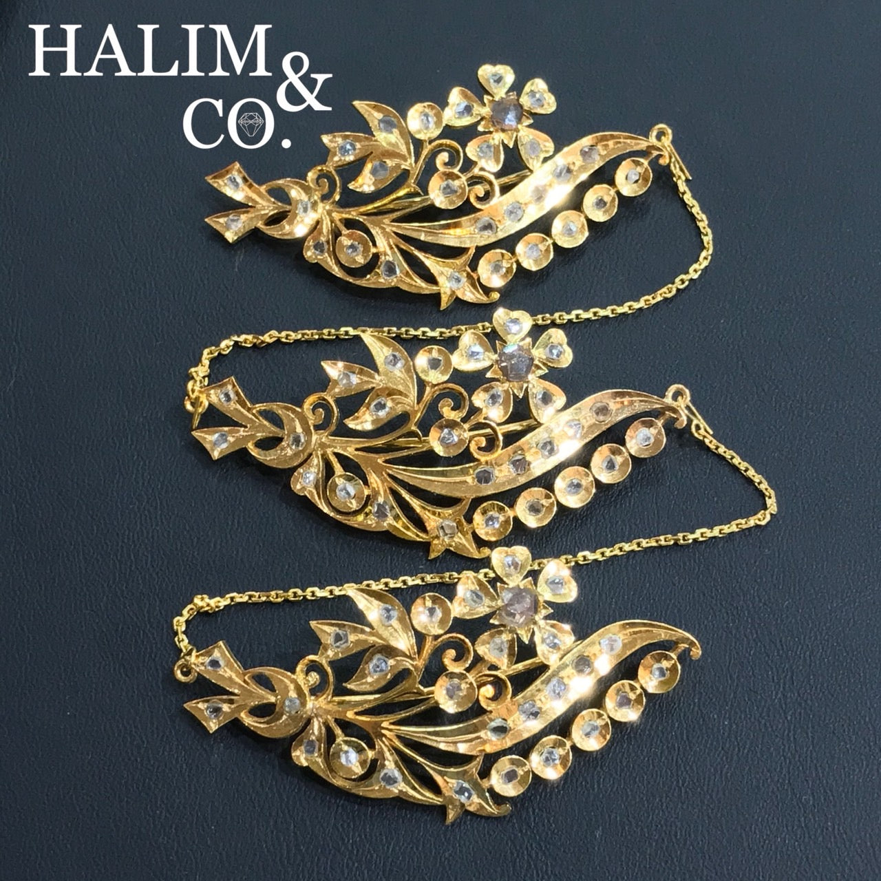 A gorgeous set of three antique gold flower brooches set with polki diamonds with patterned chains. Kebaya Jewelry / Peranakan Nyonya Jewelry