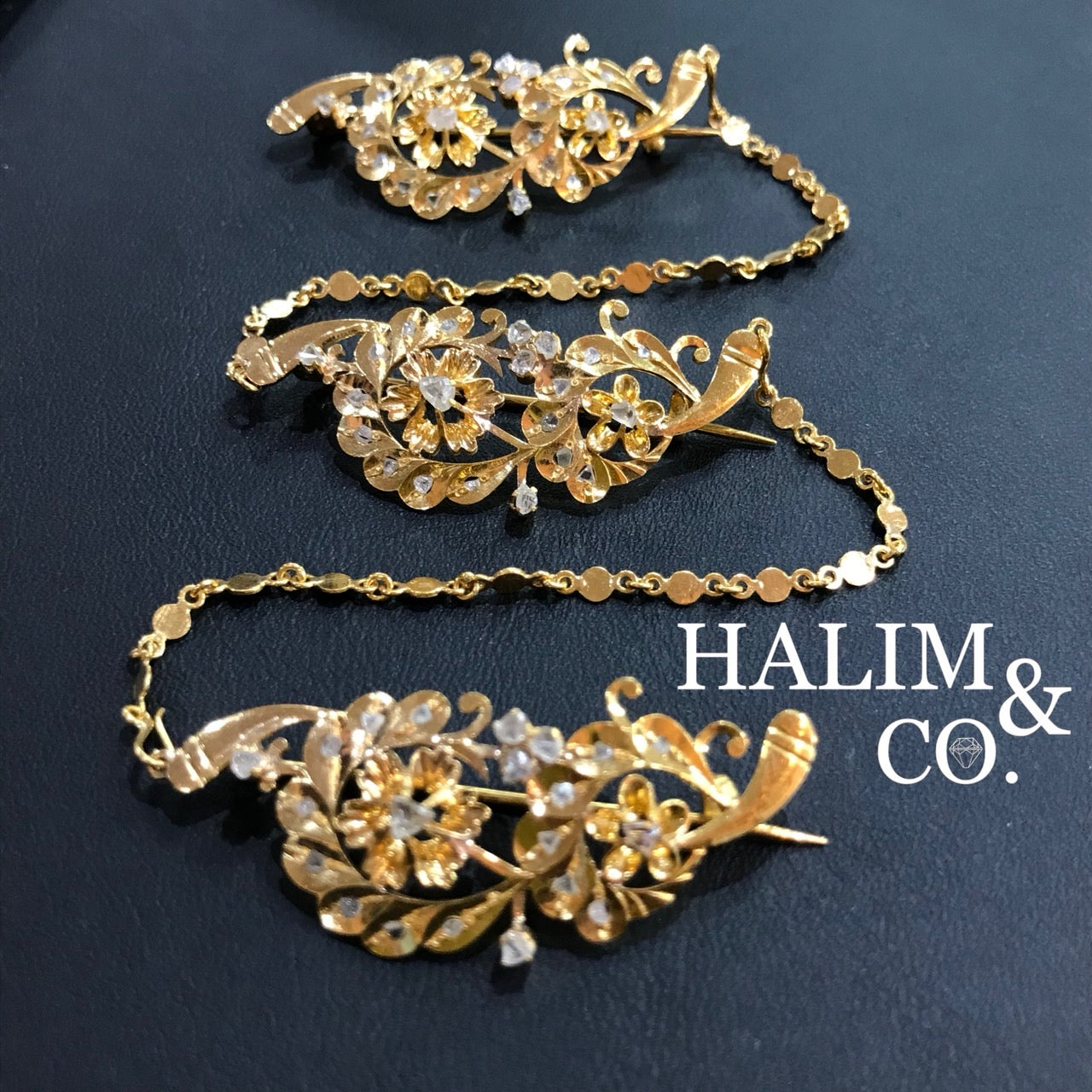 A gorgeous set of three antique gold brooches set with polki diamonds with patterned chains. Kebaya Jewelry / Peranakan Nyonya Jewelry