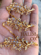 A gorgeous set of three antique gold brooches set with rose cut diamonds with patterned chains.