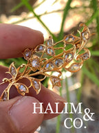 A gorgeous set of three antique gold brooches set with rose cut diamonds with patterned chains.