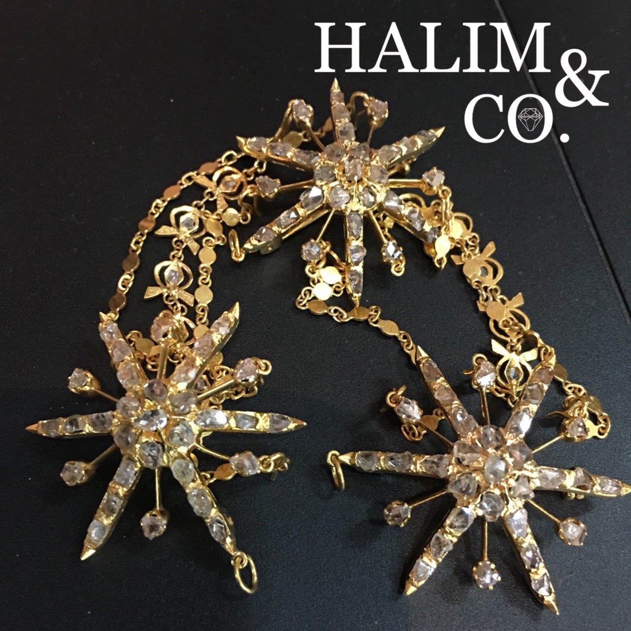 A gorgeous set of three antique gold brooches n Pendant set with polki diamonds with triple patterned chains.