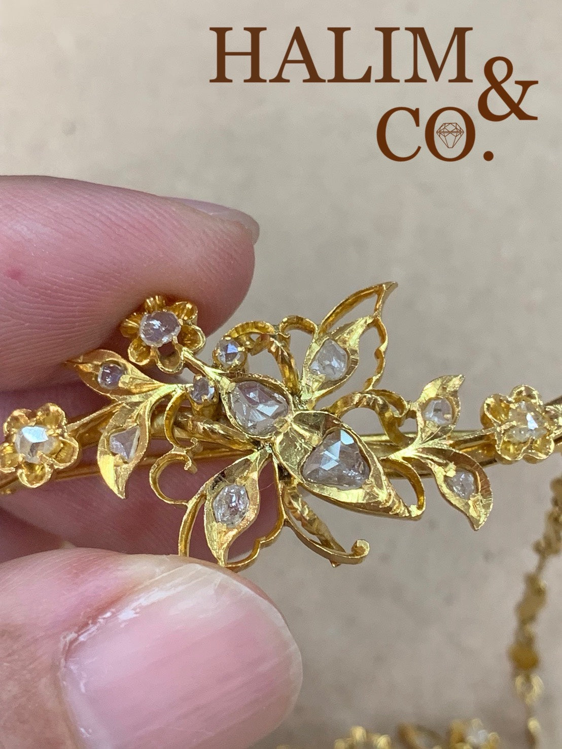 A gorgeous set of three antique gold brooches set with rose cut diamonds with patterned chains.