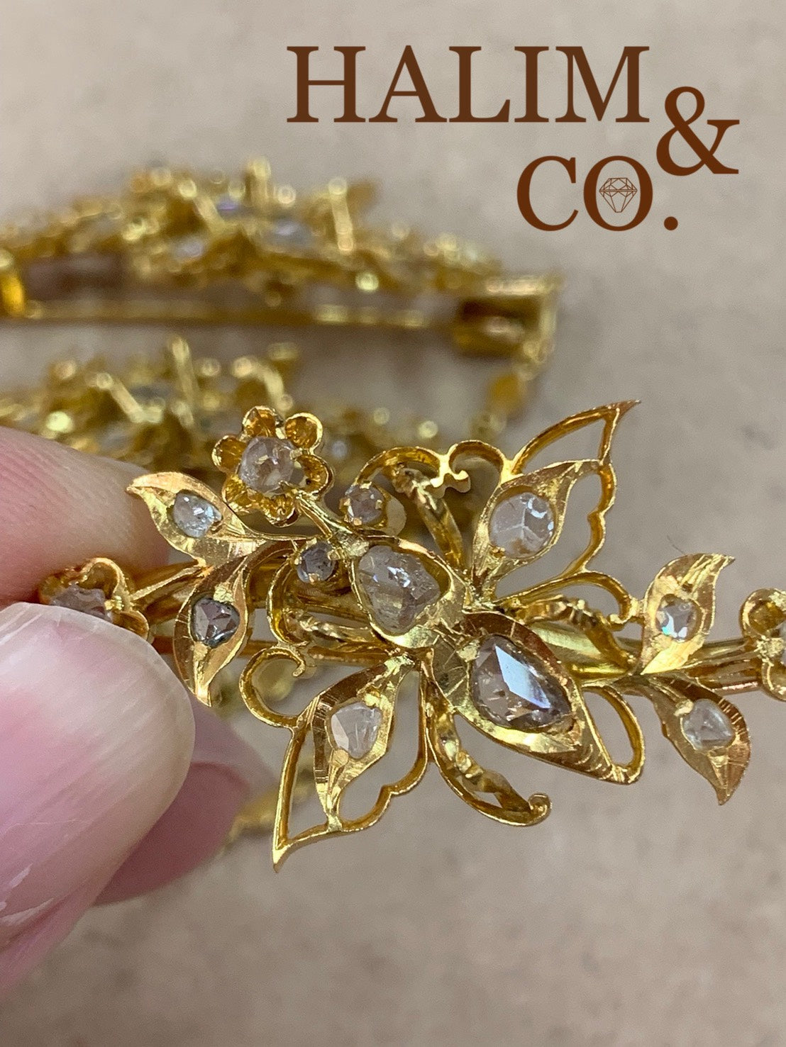 A gorgeous set of three antique gold brooches set with rose cut diamonds with patterned chains.