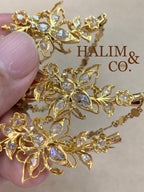 A gorgeous set of three antique gold brooches set with rose cut diamonds with patterned chains.