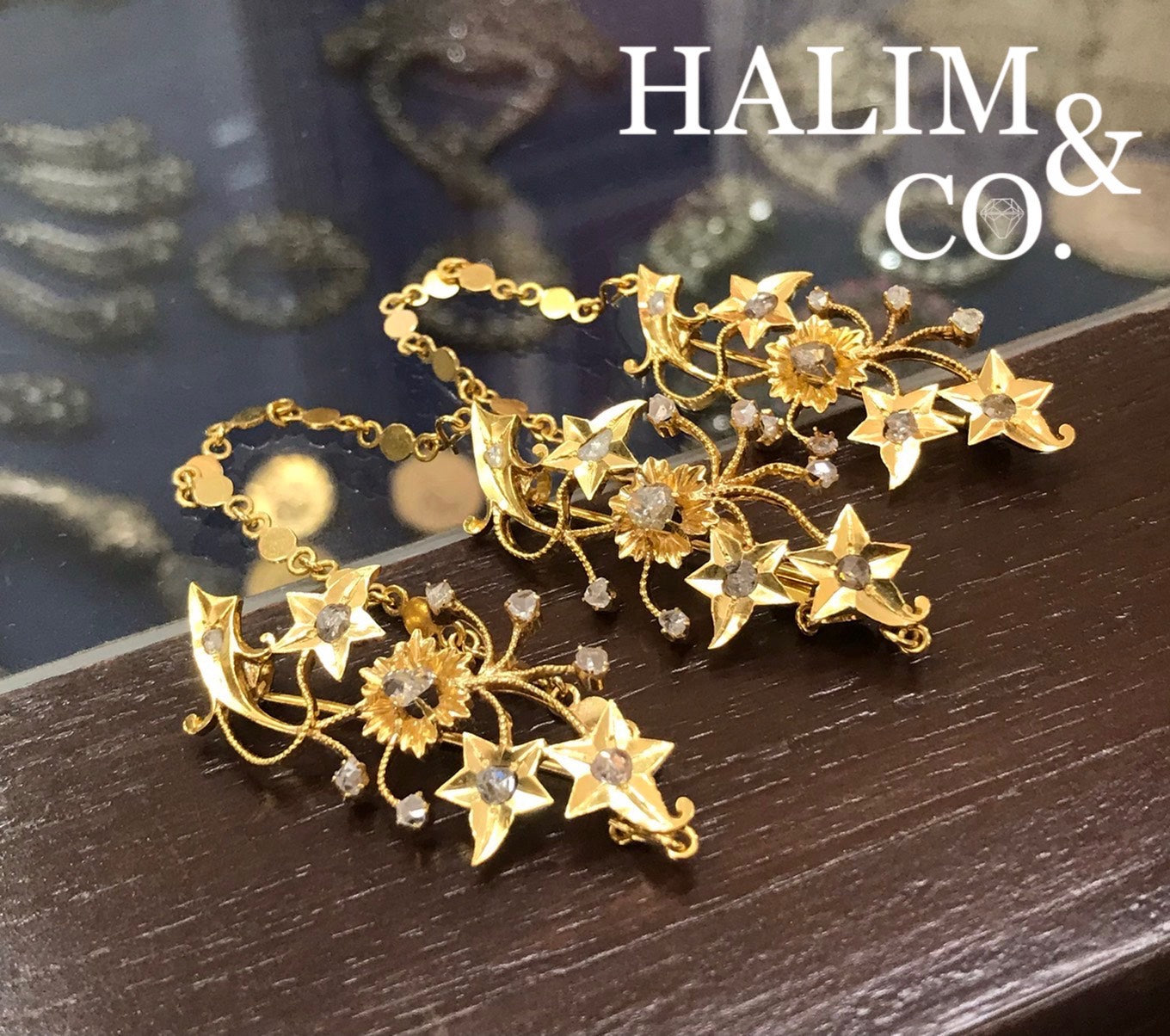 A gorgeous set of three antique gold brooches set with polki diamonds with patterned chains.