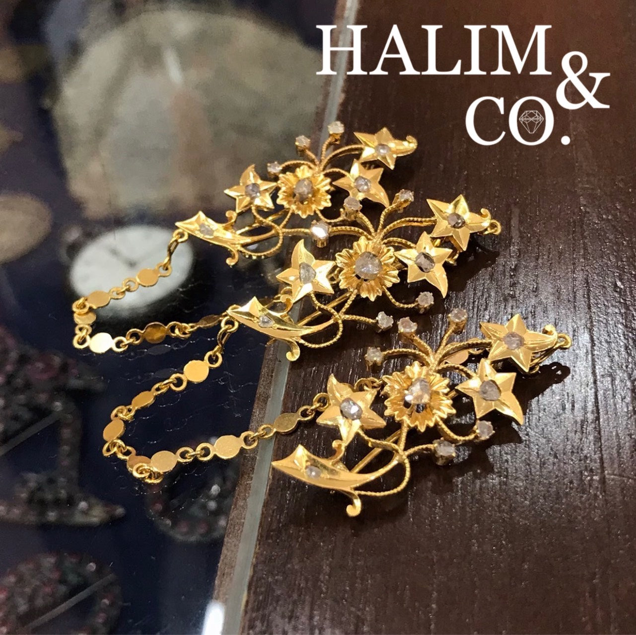 A gorgeous set of three antique gold brooches set with polki diamonds with patterned chains.