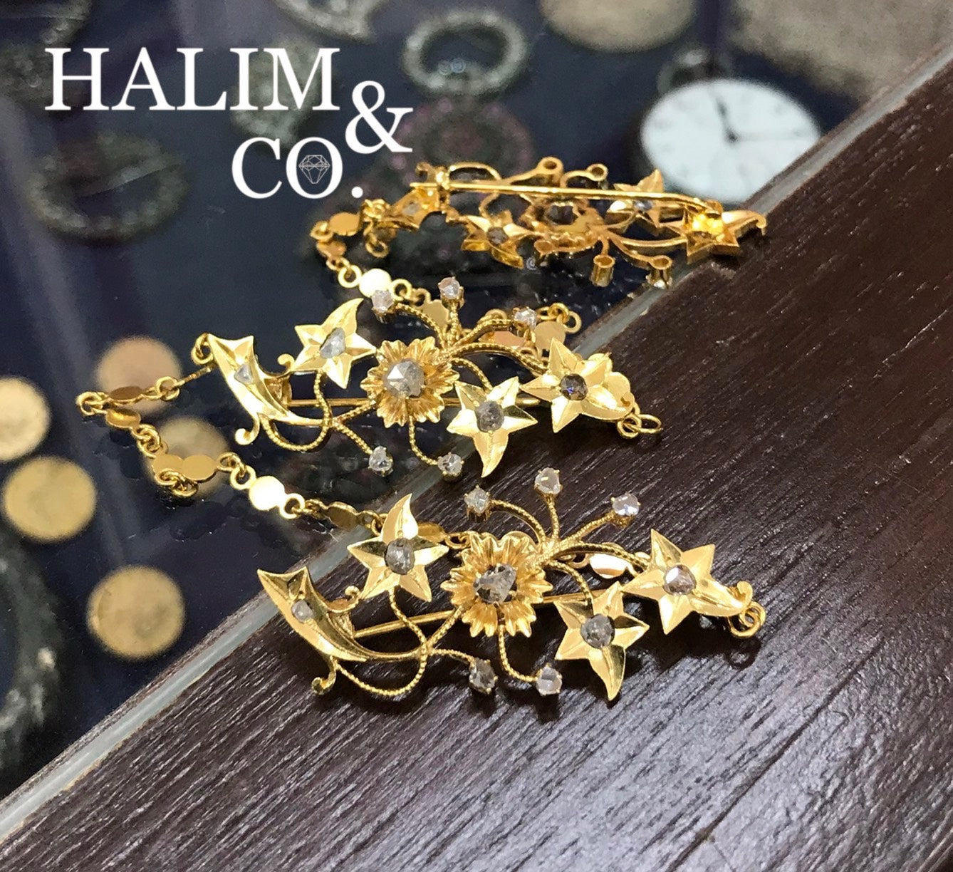 A gorgeous set of three antique gold brooches set with polki diamonds with patterned chains.